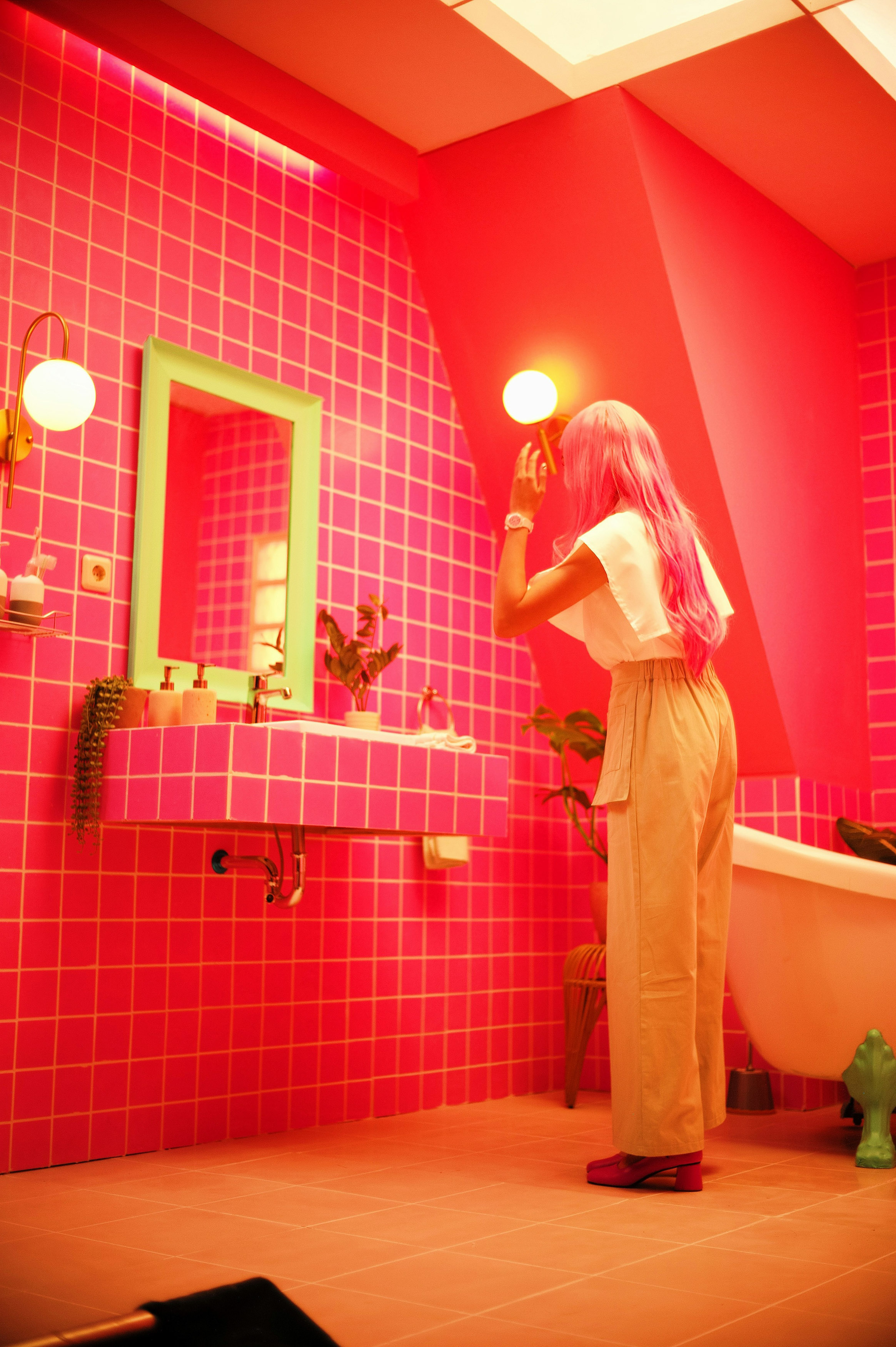 Image of a Woman Putting on Her Make-Up in the Bathroom Mirror